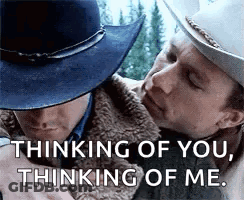 Two Men In Cowboy Hats Are Hugging Each Other And Talking . GIF