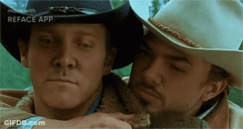 Two Men In Cowboy Hats Hugging GIF