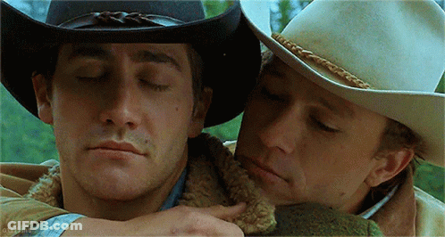 Two Men In Cowboy Hats Hugging GIF