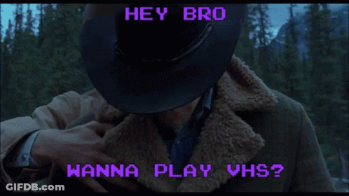 Two Men In Cowboy Hats Hugging With The Words Hey Bro Wanna Play Vhs GIF