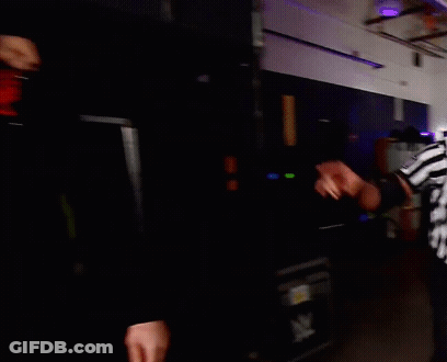 Two Men In Dark Room One With K Tattoo GIF