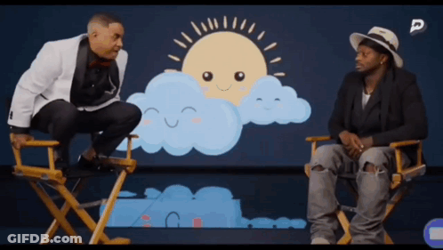 Two Men In Directors Chairs In Front Of Sun And Clouds GIF