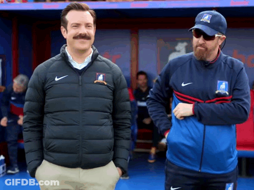 Two Men In Dugout One With Nike Hat GIF