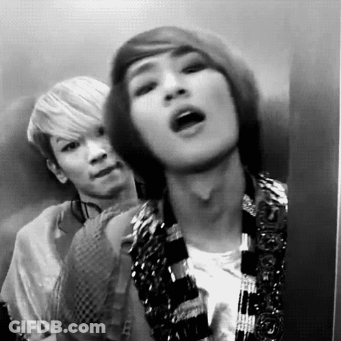 Two Men In Elevator One Making Funny Face GIF
