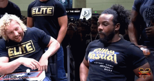 Two Men In Elite And Silly Casual Shirts GIF