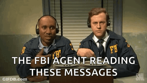 Two Men In Fbi Uniforms Are Reading Messages GIF
