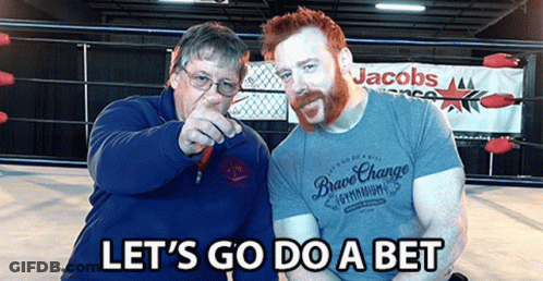 Two Men In Front Of A Sign That Says Jacobs On It GIF