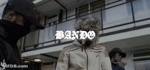 Two Men In Front Of Building With Bando GIF