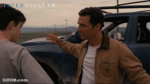 Two Men In Front Of Car With Interstellar GIF