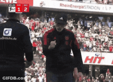 Two Men In Front Of Crowd With Sign Saying Hit GIF