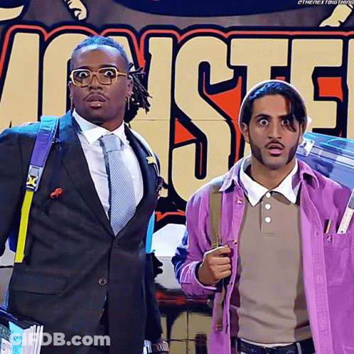 Two Men In Front Of Monsters Sign GIF