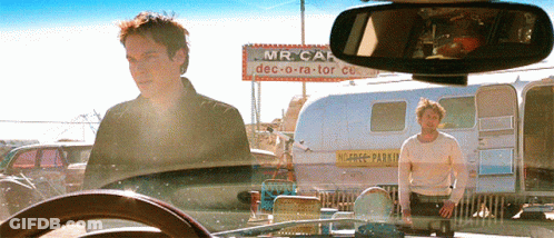 Two Men In Front Of Mr Car Sign GIF