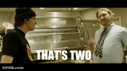 Two Men In Front Of Pizza Oven Saying That's Two GIF