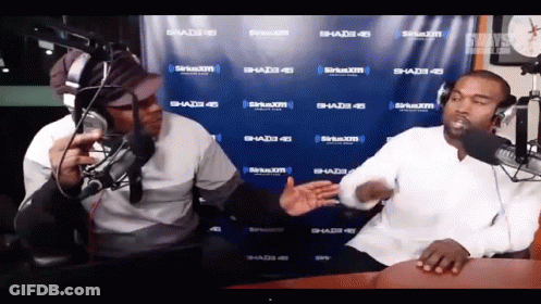 Two Men In Front Of SiriusXM Banner GIF