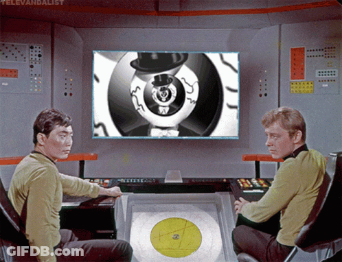 Two Men In Front Of Televandalist Screen GIF
