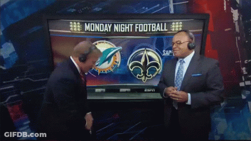 Two Men In Front Of TV Showing Monday Night Football GIF