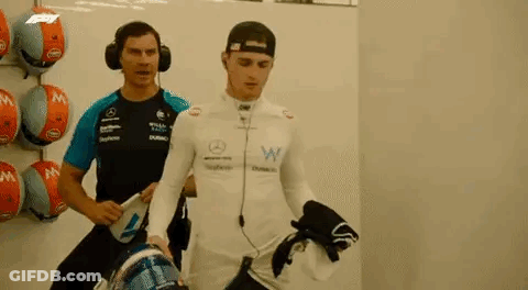 Two Men In Garage One Wearing Headphones GIF