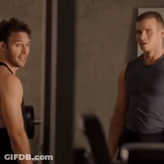 Two Men In Gym One Touching Other's Neck GIF