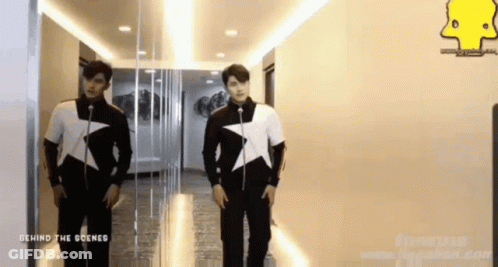 Two Men In Hallway Behind The Scenes GIF