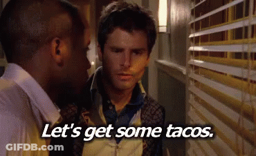 Two Men In Hallway Saying Let's Get Some Tacos GIF