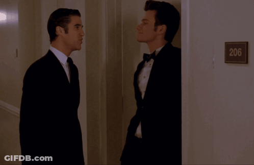 Two Men In Hallway With Sign 206 GIF