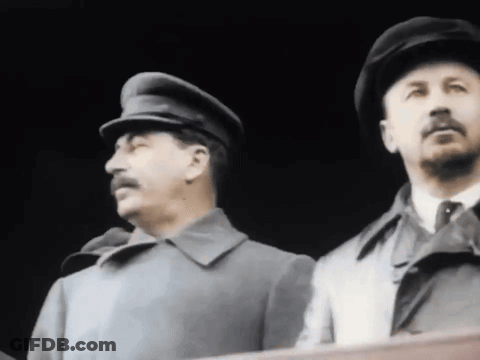 Two Men In Hats And Coats GIF