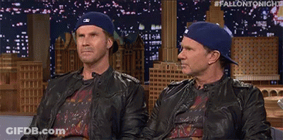 Two Men In Hats And Leather Jackets On Couch GIF