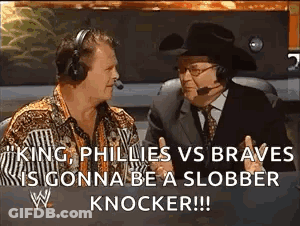 Two Men In Headphones And Hat Talking On TV GIF