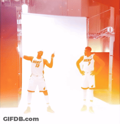 Two Men In Heat Jerseys Standing Together GIF