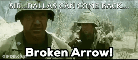 Two Men In Helmets Standing In Field GIF