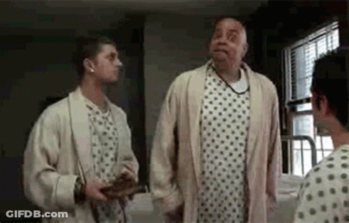 Two Men In Hospital Room One In Gown GIF