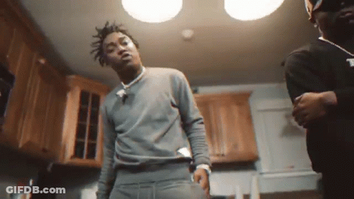 Two Men In Kitchen One In Grey Sweater GIF