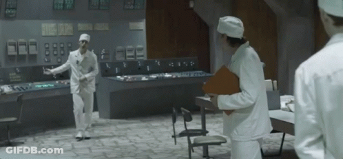 Two Men In Lab Coats Talking GIF