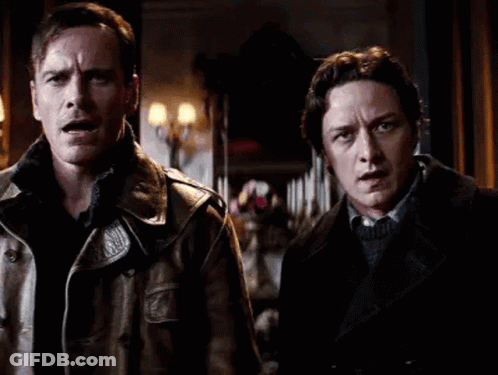Two Men In Leather Jackets In Dark Room GIF