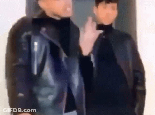 Two Men In Leather Jackets Talking GIF