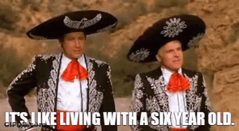 Two Men In Mariachi Costumes Are Standing Next To Each Other And Saying `` It 'S Like Living With A Six Year Old '' . GIF