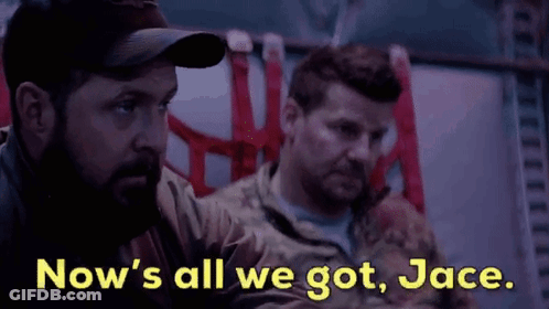 Two Men In Military Uniforms Are Sitting Next To Each Other And Talking . GIF