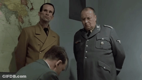 Two Men In Military Uniforms Are Standing Next To Each Other And One Has The Number 9 On His Sleeve GIF