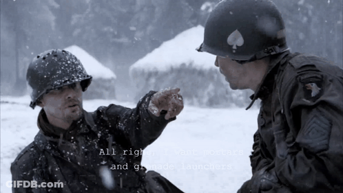 Two Men In Military Uniforms Are Talking In The Snow GIF