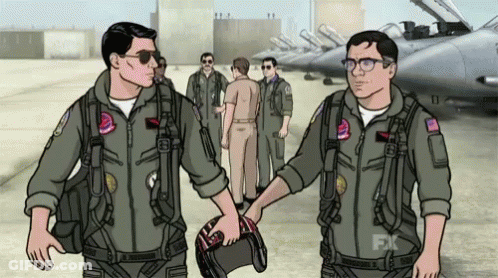 Two Men In Military Uniforms Shaking Hands In Front Of Jets GIF