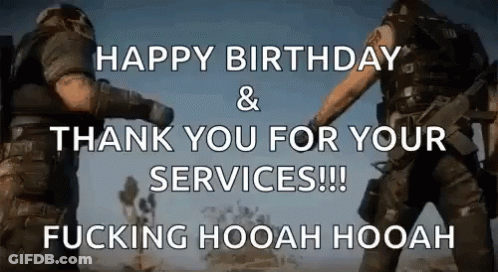 Two Men In Military Uniforms Standing In Desert GIF