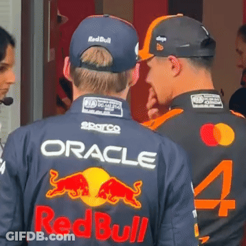 Two Men In Oracle And Redbull Jerseys Talking GIF