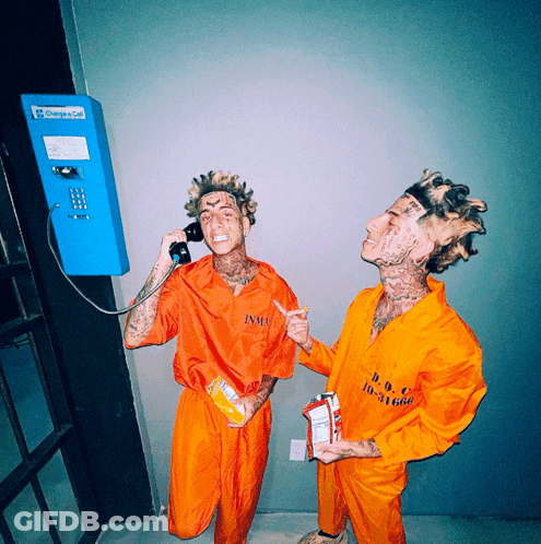Two Men In Orange Jumpsuits Talking On Phone Saying Change A Call GIF