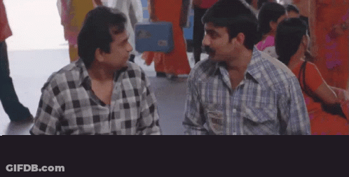 Two Men In Plaid Shirts Talking GIF