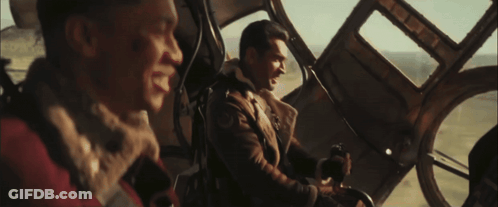Two Men In Plane With Hotdog GIF