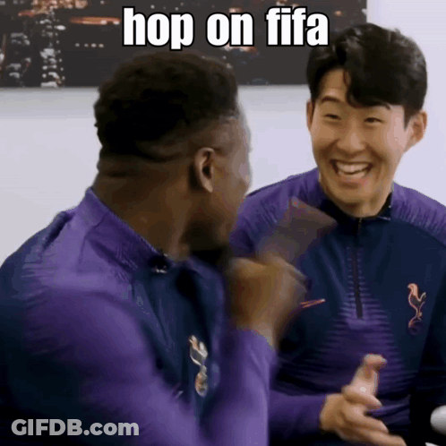 Two Men In Purple Shirts Are Laughing And One Of Them Says Hop On Fifa GIF