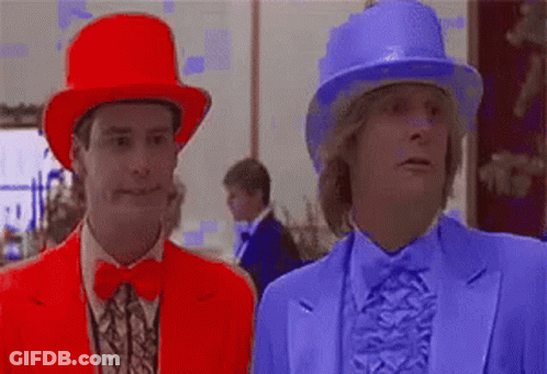 Two Men In Red And Blue Hats Standing Together GIF