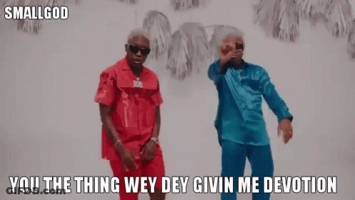 Two Men In Red And Blue Shirts Dancing GIF