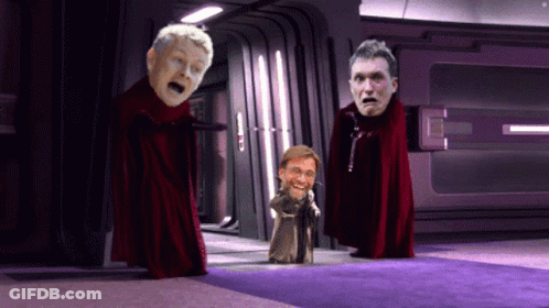 Two Men In Red Capes GIF