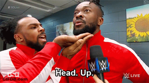 Two Men In Red Jackets Talking GIF